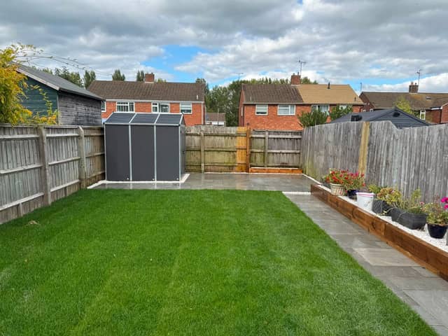 Landscaped garden with new lawn, sleeper beds and paving